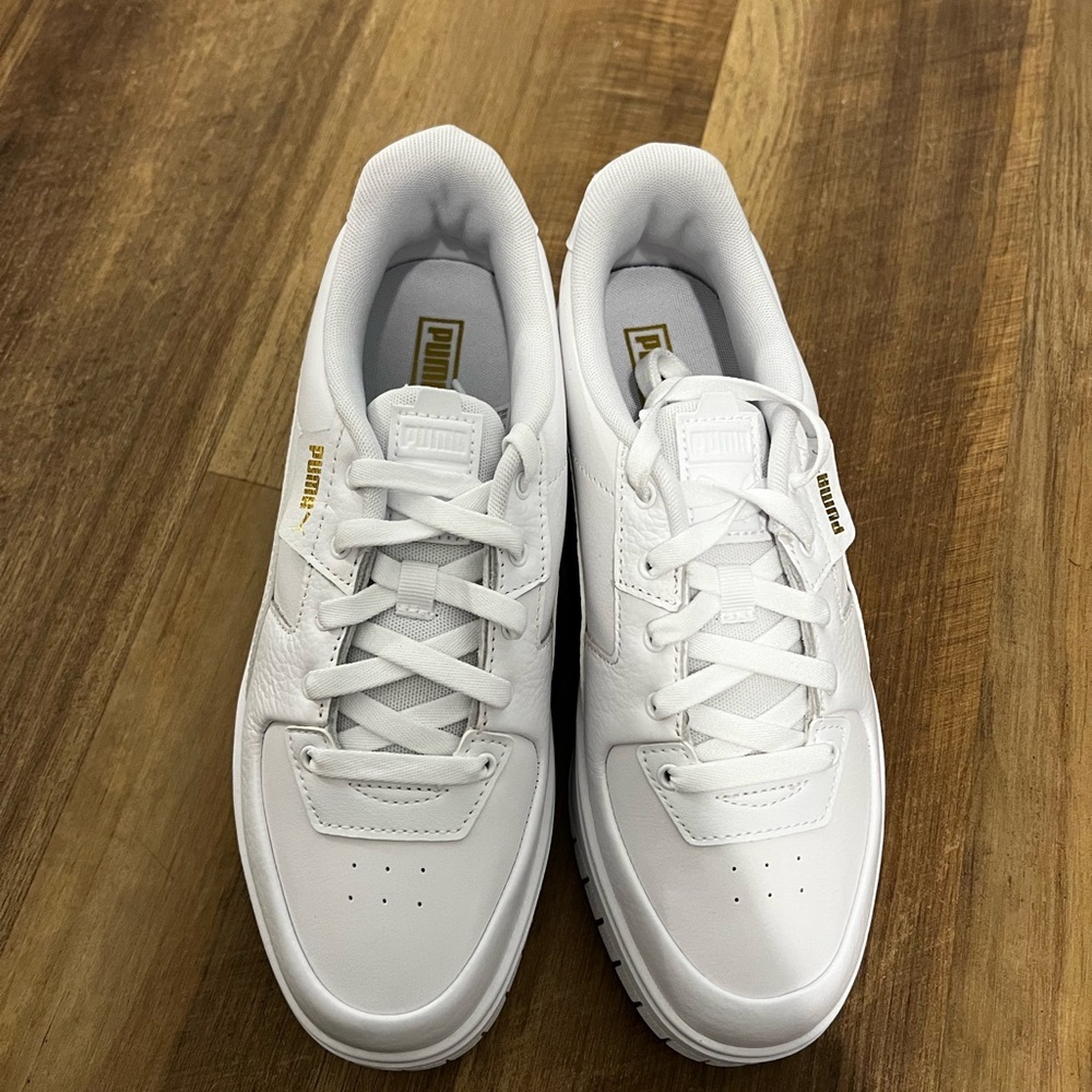 White Pumas, women’s 10, never worn